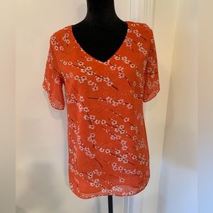 Cabi short sleeve size Small.  Orange background